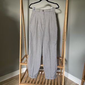 Trendy vintage pants with fitted waist and looser fit along legs!